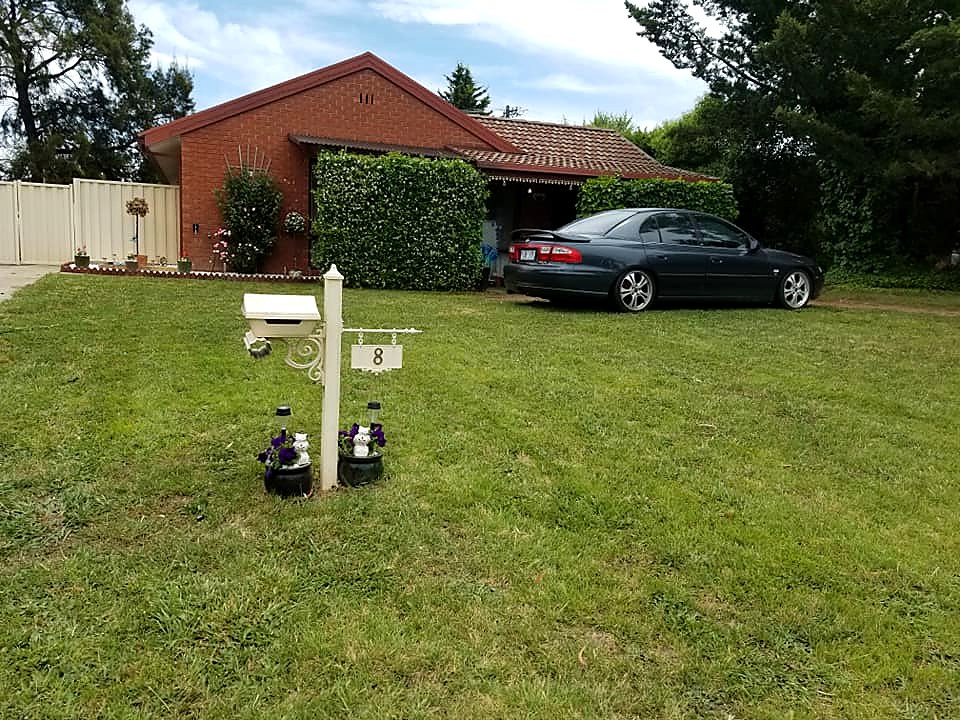 Tidy front garden and lawn after garden maintenance work in Canberra